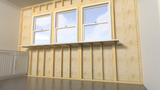 A front view of three windows with a white bar beneath it held in place by Original Granite Bracket’s Side Wall Free Hanging Shelf Bracket on an exposed wooden wall with a white counter off to the side.