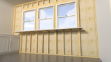 A front view of three windows with a white bar beneath it held in place by Original Granite Bracket’s Side Wall Free Hanging Shelf Bracket on an exposed wooden wall with a white counter off to the side.