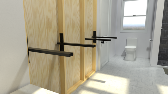 4 Black Original Free Floating Vanity Brackets secured to an unfinished wooden bathroom wall in a white bathroom with a window in the background.