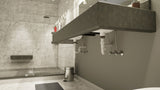 A gray tiled vanity with sinks with a marbled tile standing shower in the background.